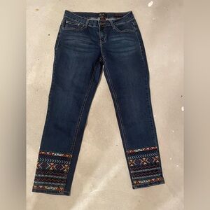 Dark Blue Women’s Jeans with Embroidered Hem
Skinny ankle